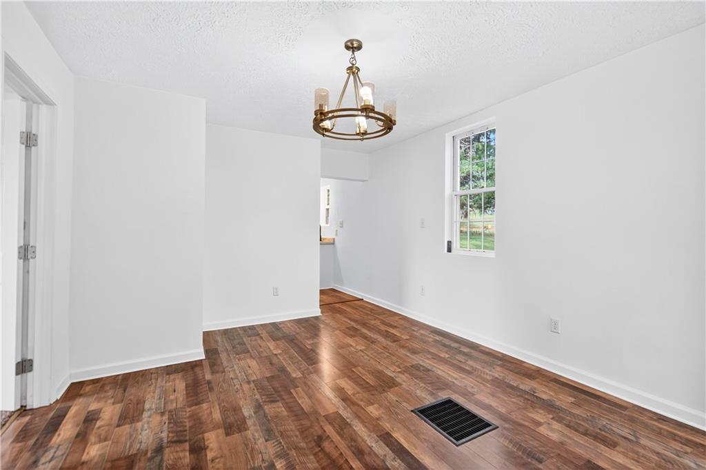235 Little Summit Road Dunbar, PA 15431 - Photo 18 of 31 an empty room with wooden floor fan and window
