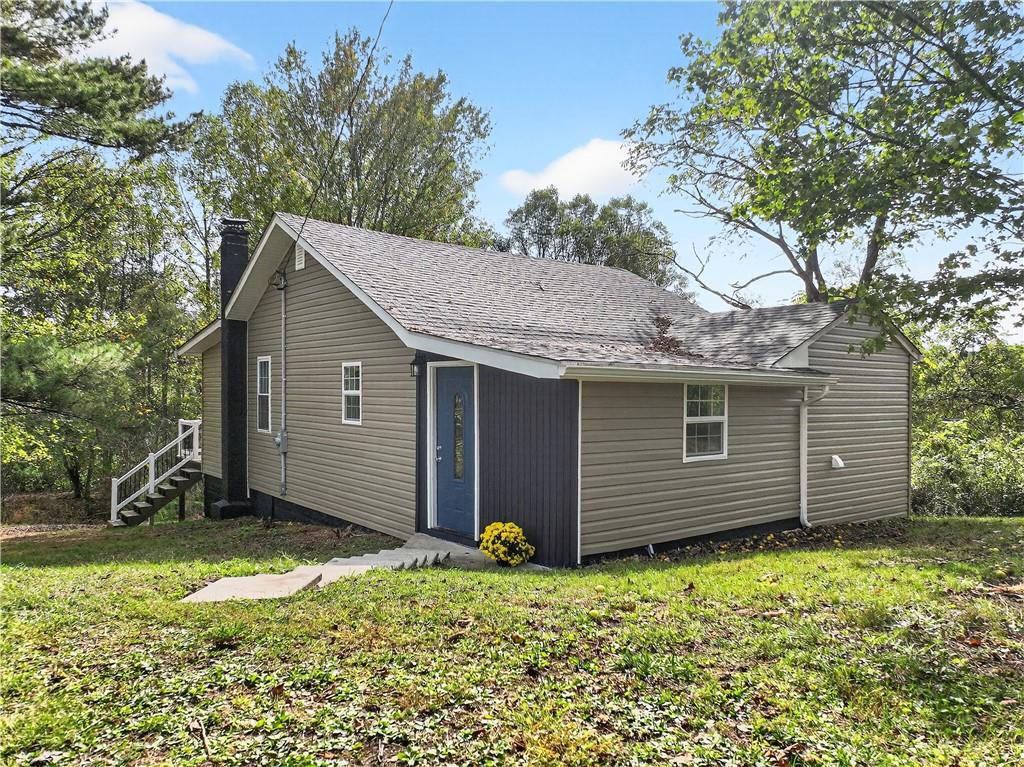 235 Little Summit Road Dunbar, PA 15431 - Photo 2 of 31 a backyard of a house with barbeque oven