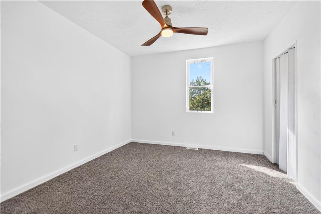 235 Little Summit Road Dunbar, PA 15431 - Photo 22 of 31 a view of room with window and ceiling fan