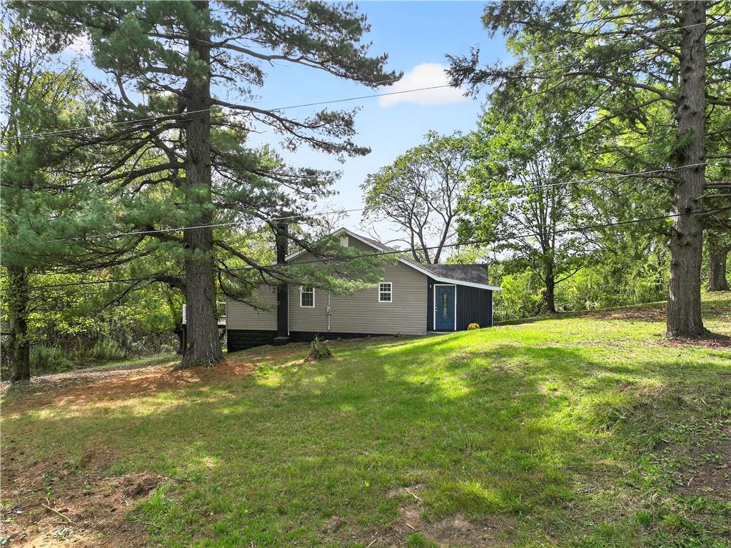 235 Little Summit Road Dunbar, PA 15431 - Photo 3 of 31 a tall house with a yard