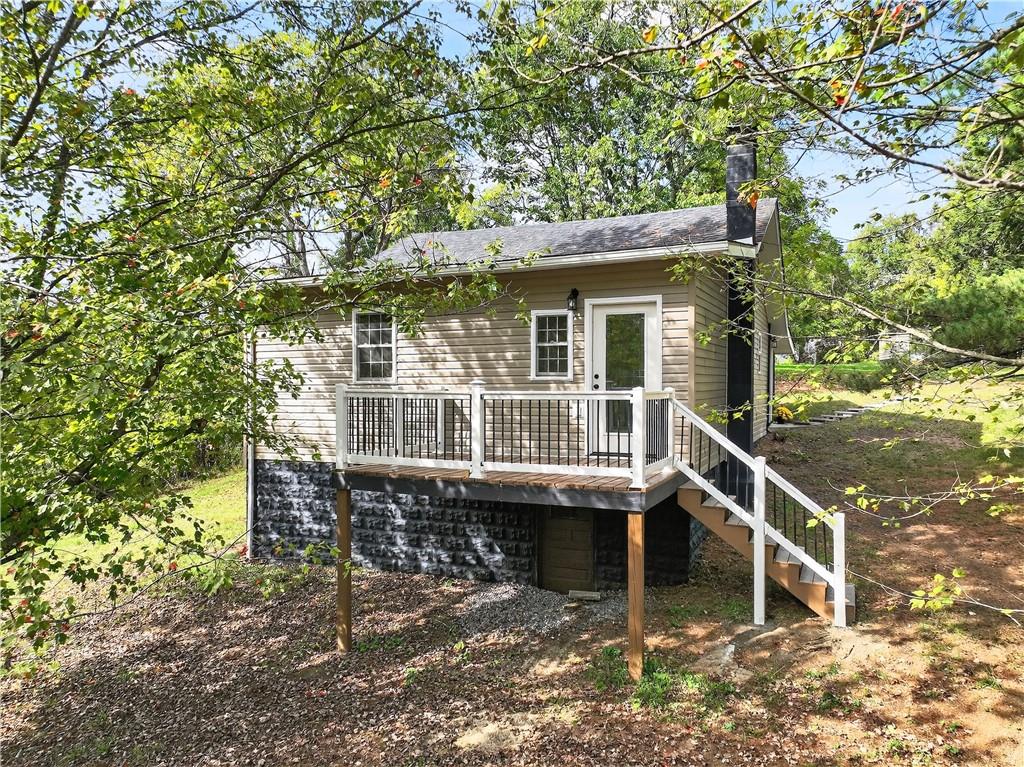 235 Little Summit Road Dunbar, PA 15431 - Photo 5 of 31 a view of a house with backyard porch and sitting area