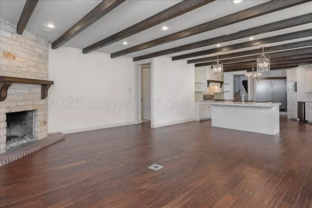 a view of a a dining room with furniture window and wooden floor