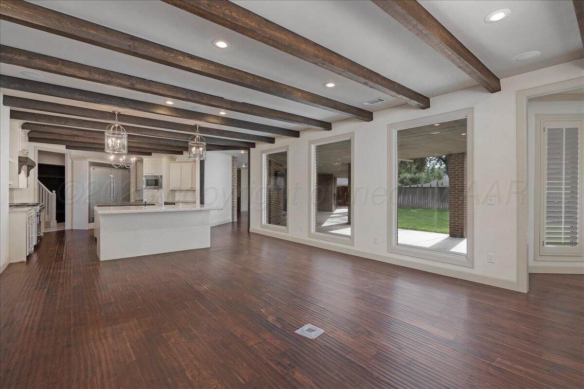 6107 Blue Sage Circle Amarillo, TX 79124 - Photo 21 of 79 a view of an empty room with wooden floor and a window