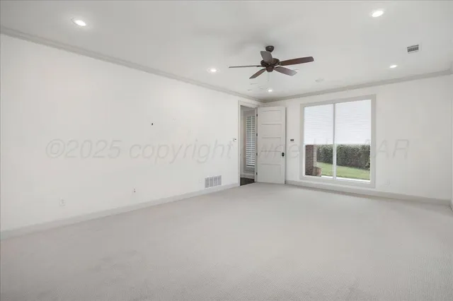 a view of a hallway with paintings on the wall
