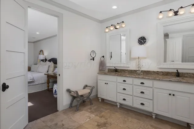 a bathroom with a double vanity sink and mirror