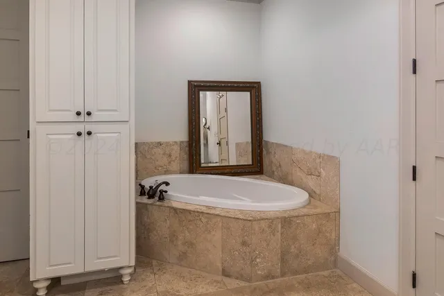 a bedroom with a bed and furniture with window