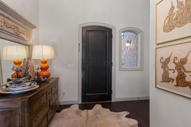 a front view of a house with a large window