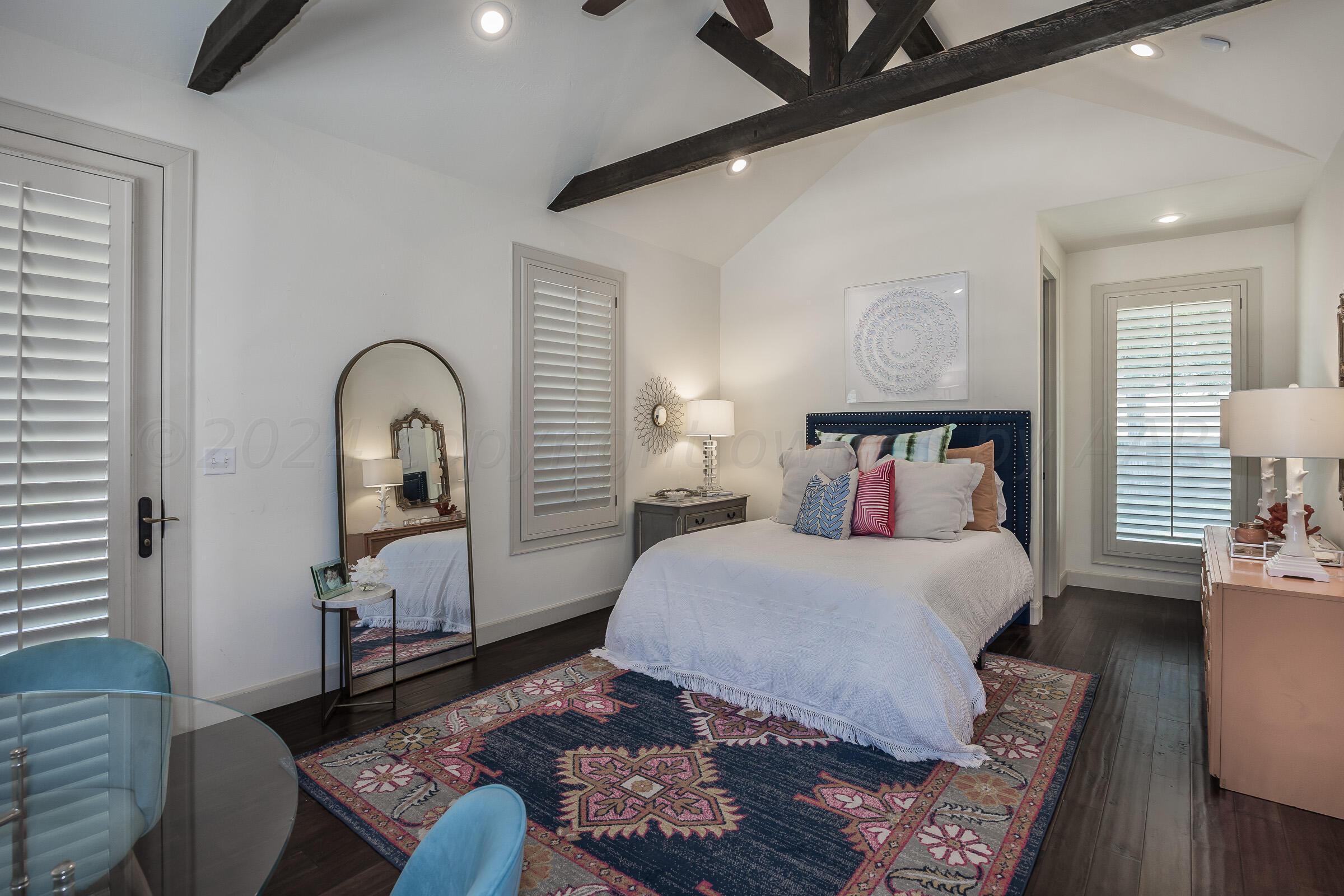 6107 Blue Sage Circle Amarillo, TX 79124 - Photo 43 of 79 a bedroom with a bed and wooden floor