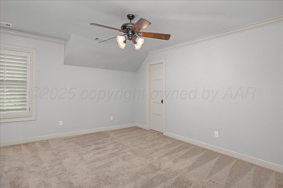 6107 Blue Sage Circle Amarillo, TX 79124 - Photo 57 of 79 a view of an empty room with a chandelier fan