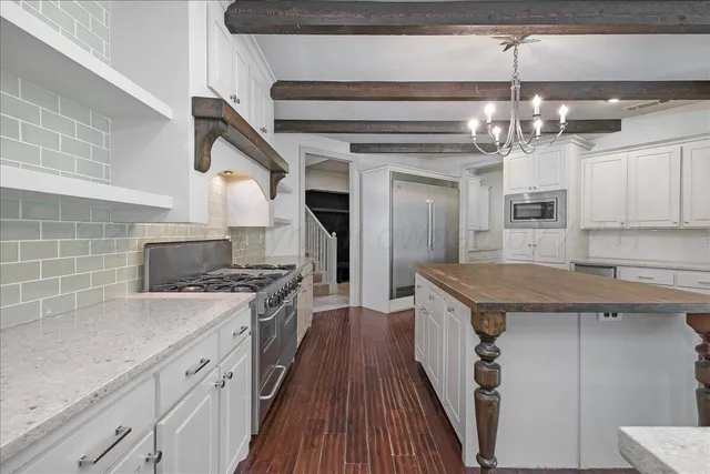 a kitchen with a table and chairs in it