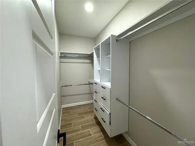a bathroom with a shower and a sink