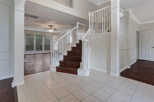a view of entryway and hall with wooden floor