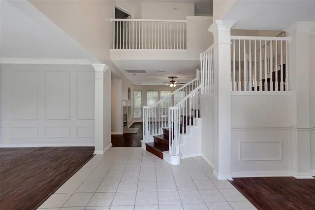 a view of entryway with stairs and a rug