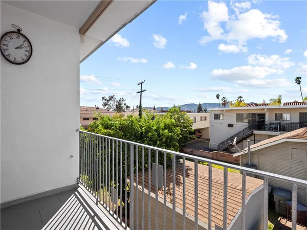 a view of balcony with furniture