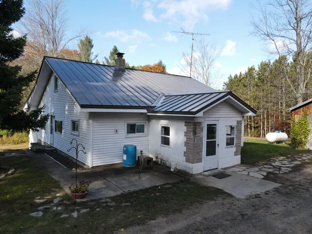 $410,000 | 401 South Bass Lake Avenue, Harrison, MI 48625