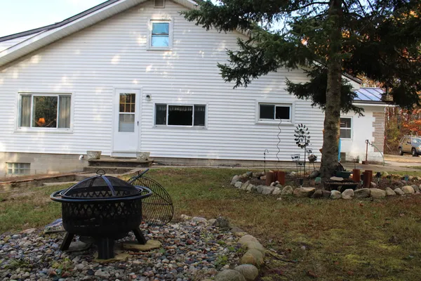 $400,000 | 401 South Bass Lake Avenue, Harrison, MI 48625