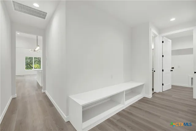 a view of an empty walk in closet