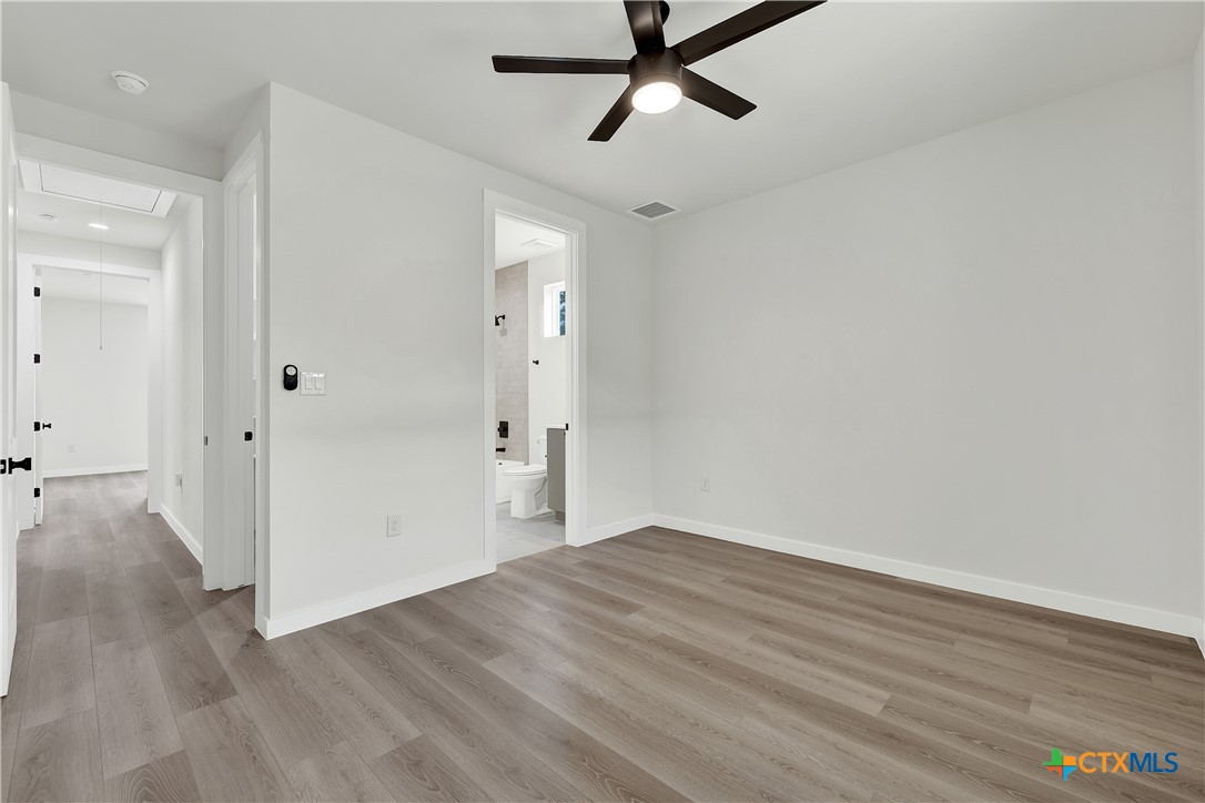 328 Compass Rose Spring Branch, TX 78070 - Photo 36 of 48 a view of a room with wooden floor and white walls