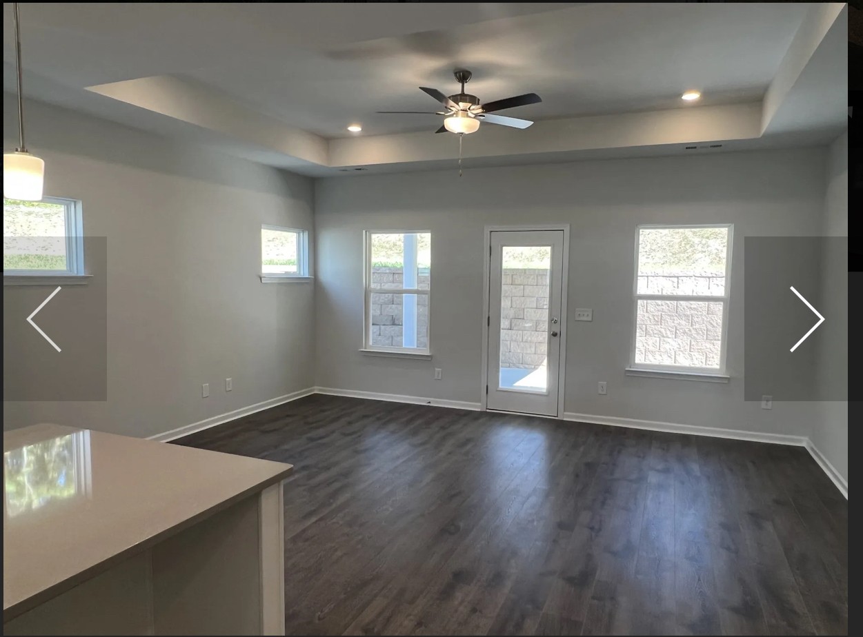 7147 Pepper Tree Circle Fairview, TN 37062 - Photo 4 of 6 an empty room with wooden floor and windows