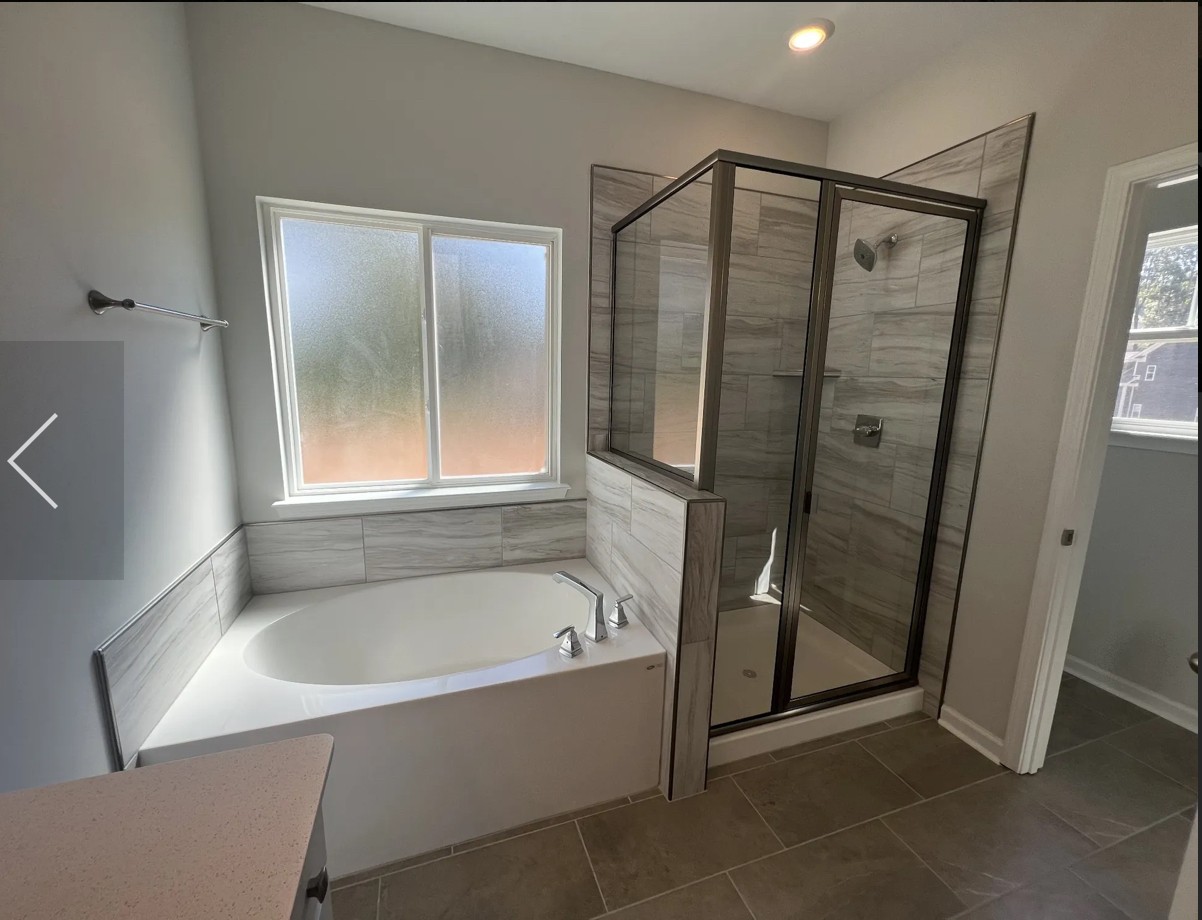 7147 Pepper Tree Circle Fairview, TN 37062 - Photo 6 of 6 a bathroom with a bathtub and a shower