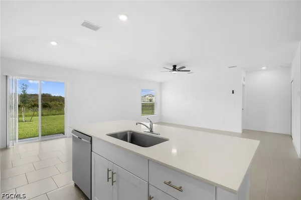 a kitchen with a sink and a window