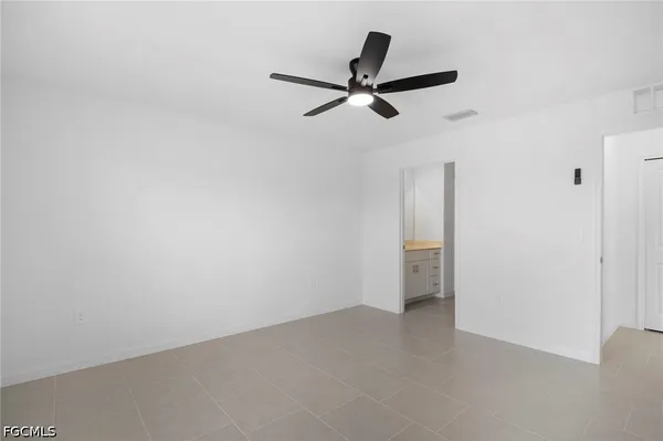 a view of a big room with a ceiling fan
