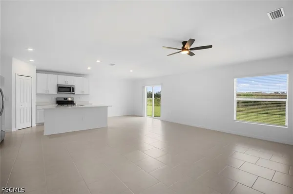 a view of a kitchen with a sink and a window