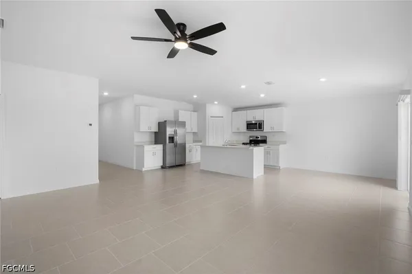 a view of a kitchen with a sink and a microwave