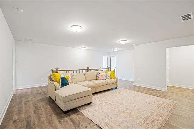 a living room with furniture and a rug