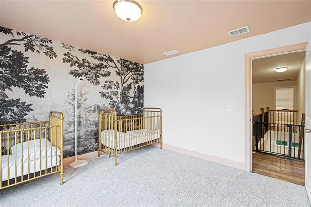 a view of a livingroom with entryway and furniture
