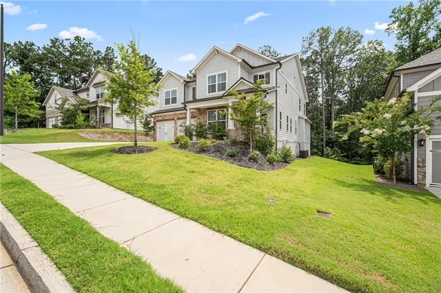 a front view of a house with a yard