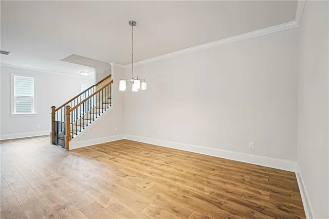 a view of an empty room with stairs