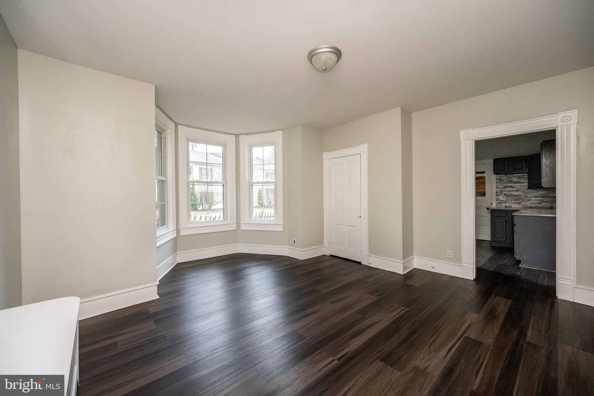 449 South 3rd Street Oakland, MD 21550 - Photo 11 of 64 wooden floor in an empty room with a window