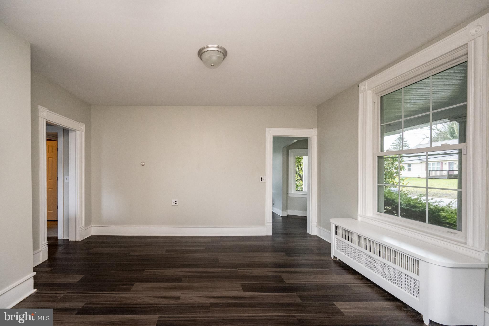 449 South 3rd Street Oakland, MD 21550 - Photo 12 of 64 a view of a room with wooden floor and windows