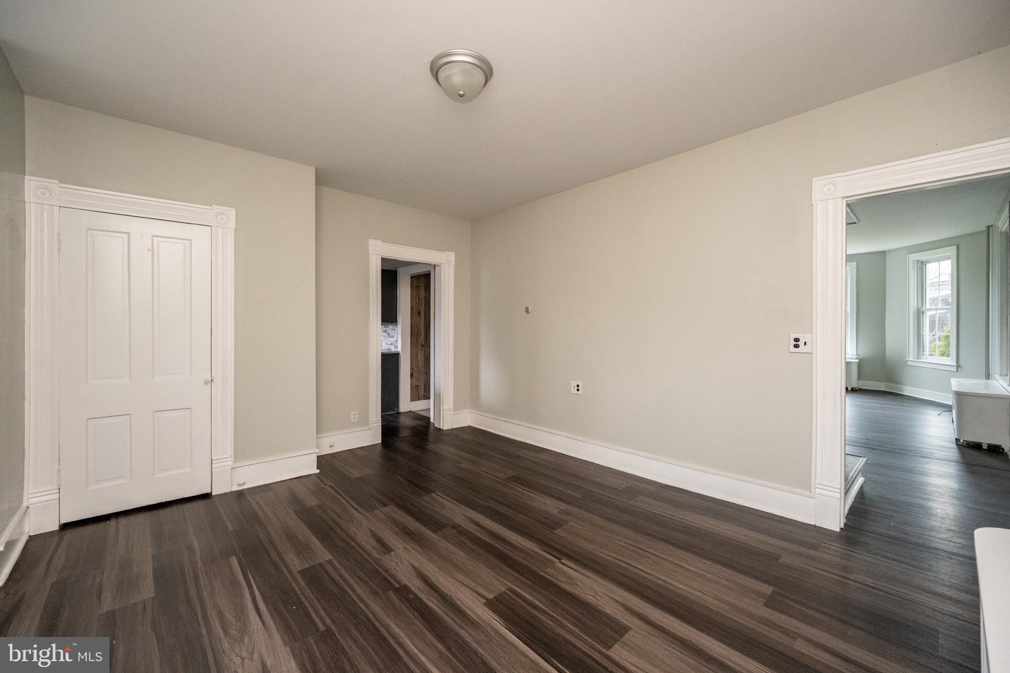 449 South 3rd Street Oakland, MD 21550 - Photo 13 of 64 a view of an empty room with wooden floor and a window
