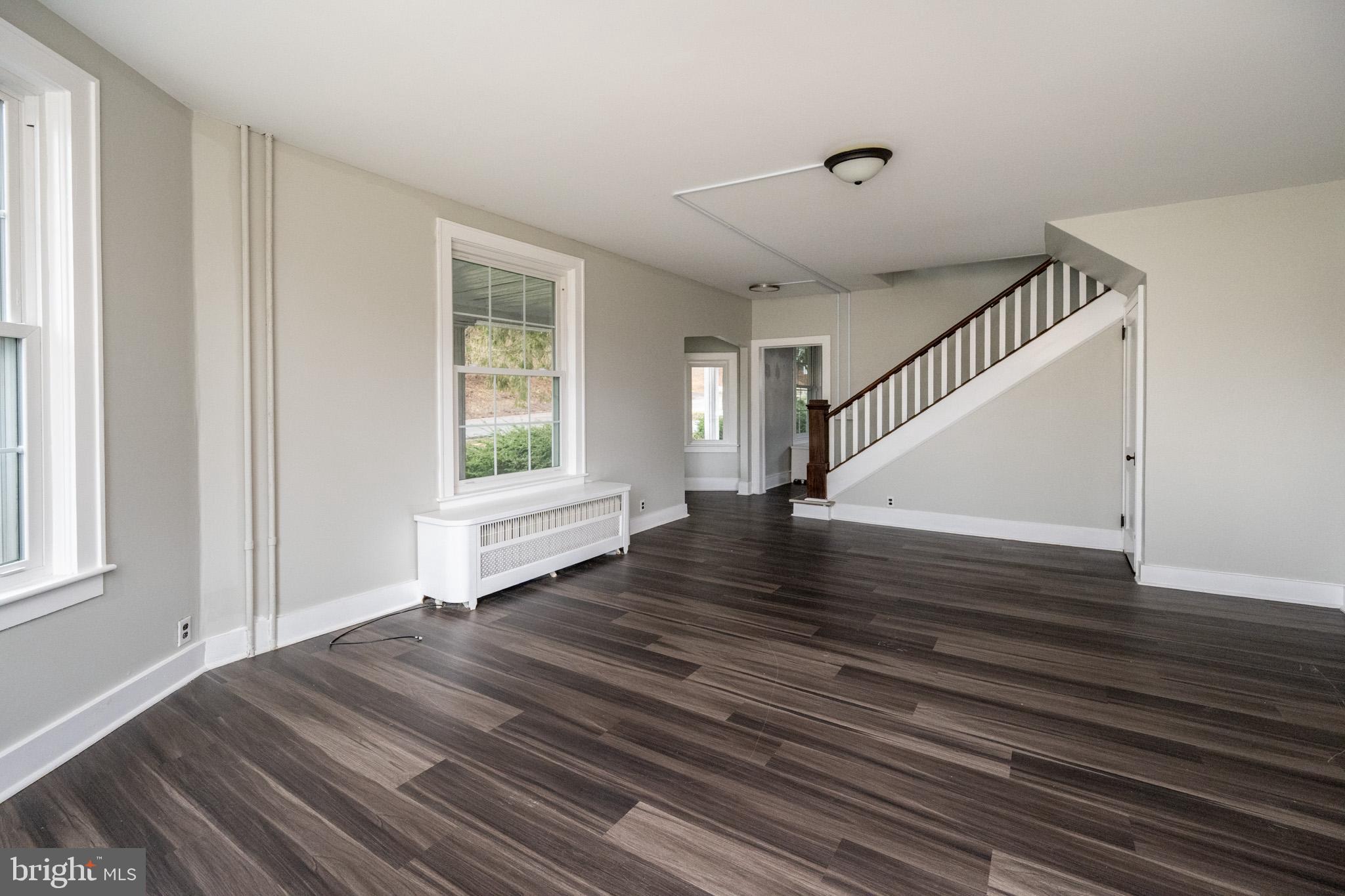 449 South 3rd Street Oakland, MD 21550 - Photo 18 of 64 a view of an empty room with wooden floor and a window