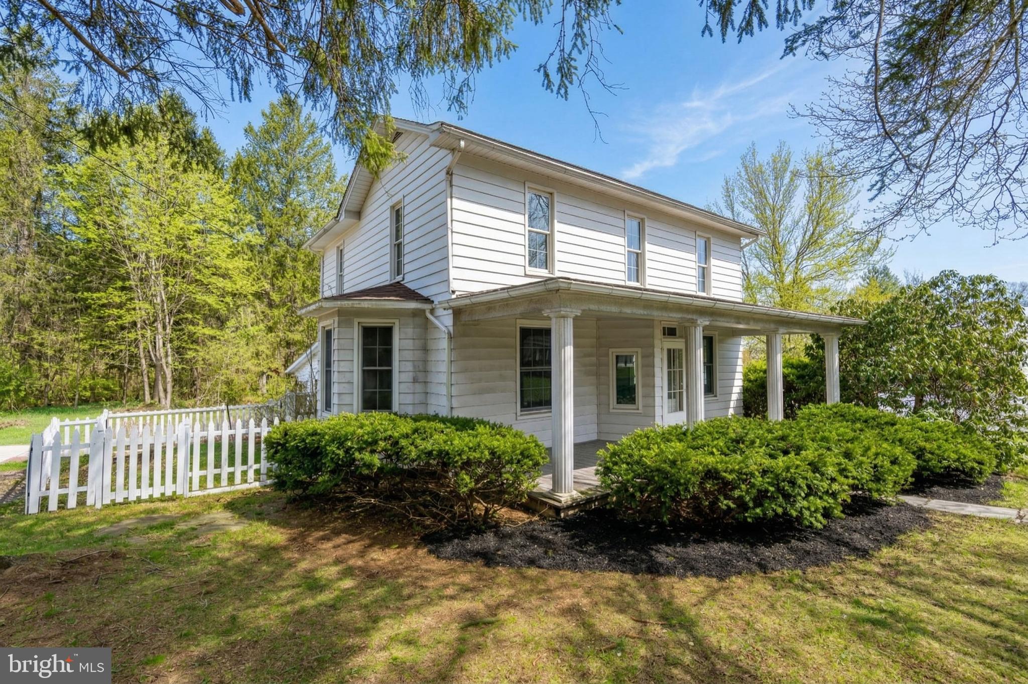449 South 3rd Street Oakland, MD 21550 - Photo 2 of 64 a front view of a house with a yard