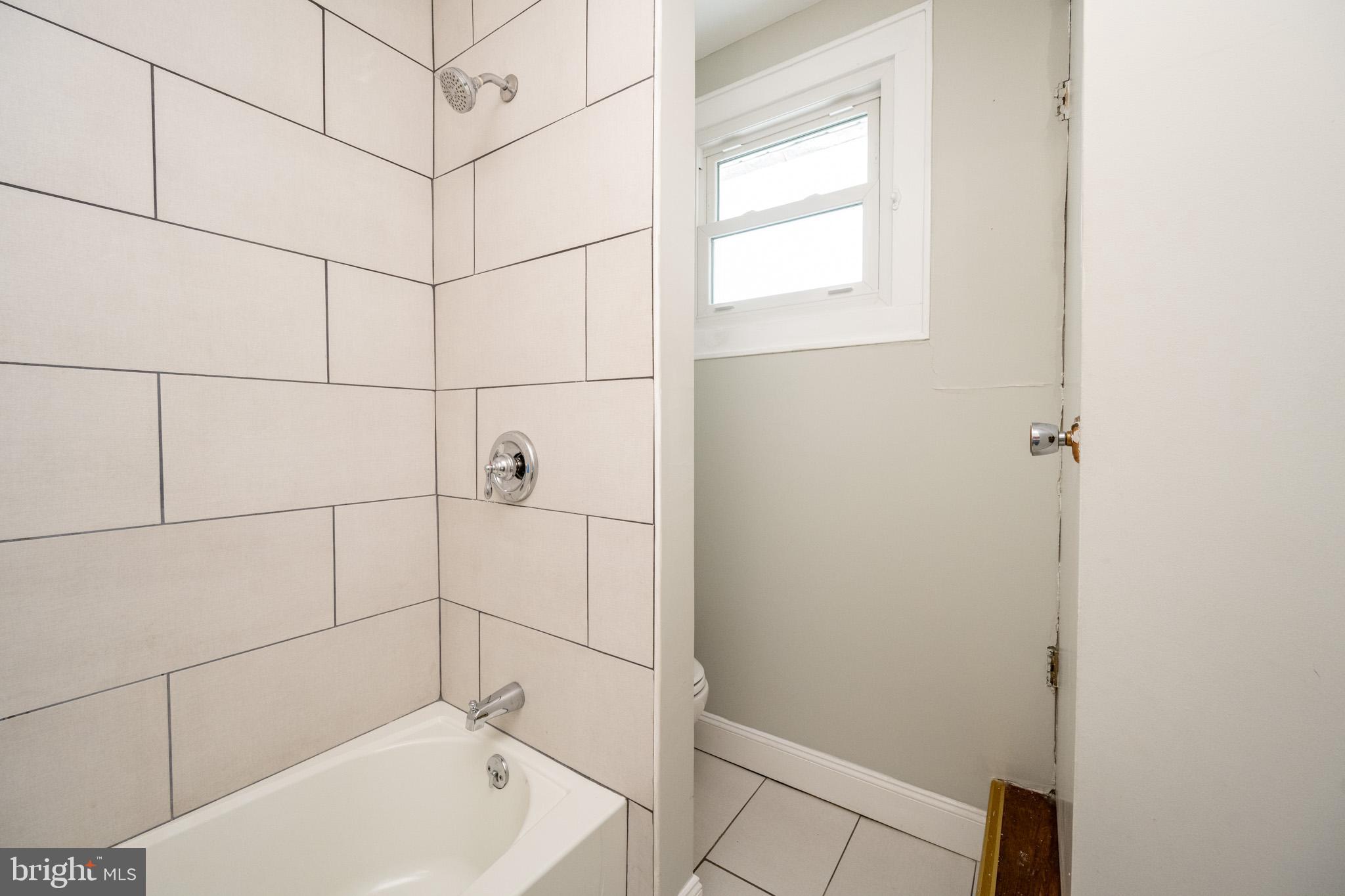 449 South 3rd Street Oakland, MD 21550 - Photo 24 of 64 Modern bathroom with sleek tile design.