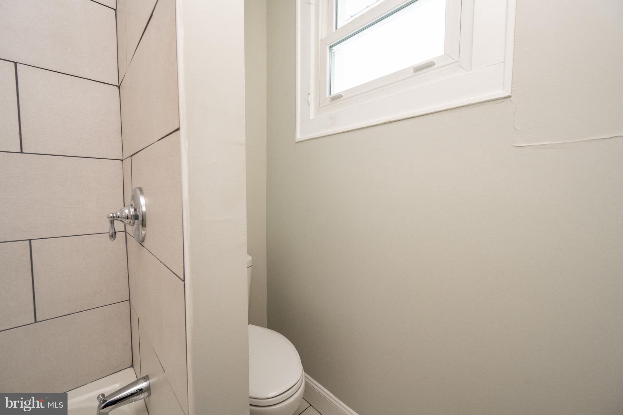 449 South 3rd Street Oakland, MD 21550 - Photo 25 of 64 a white toilet sitting next to a bathroom sink