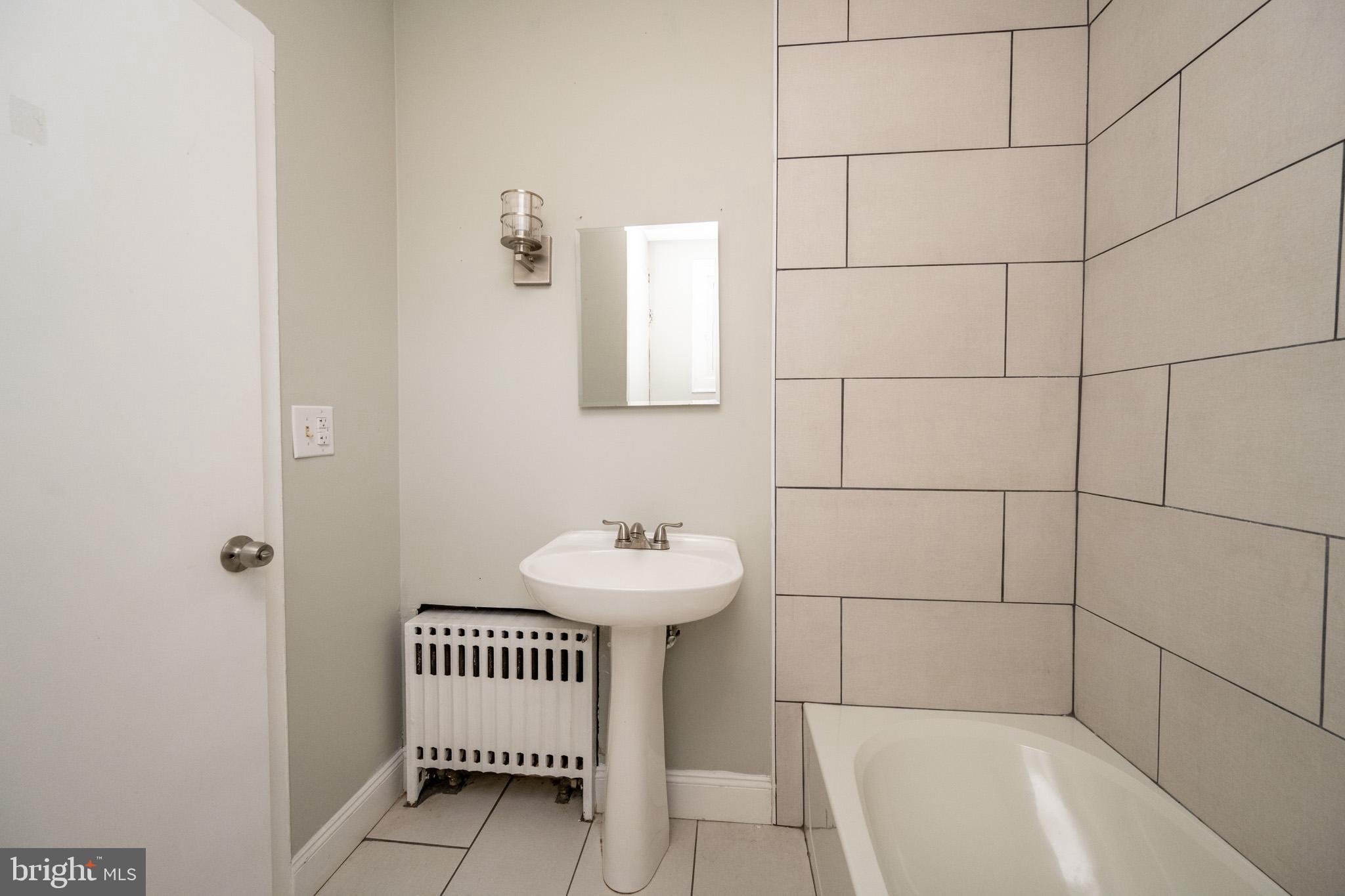 449 South 3rd Street Oakland, MD 21550 - Photo 26 of 64 a bathroom with a sink and a bathtub