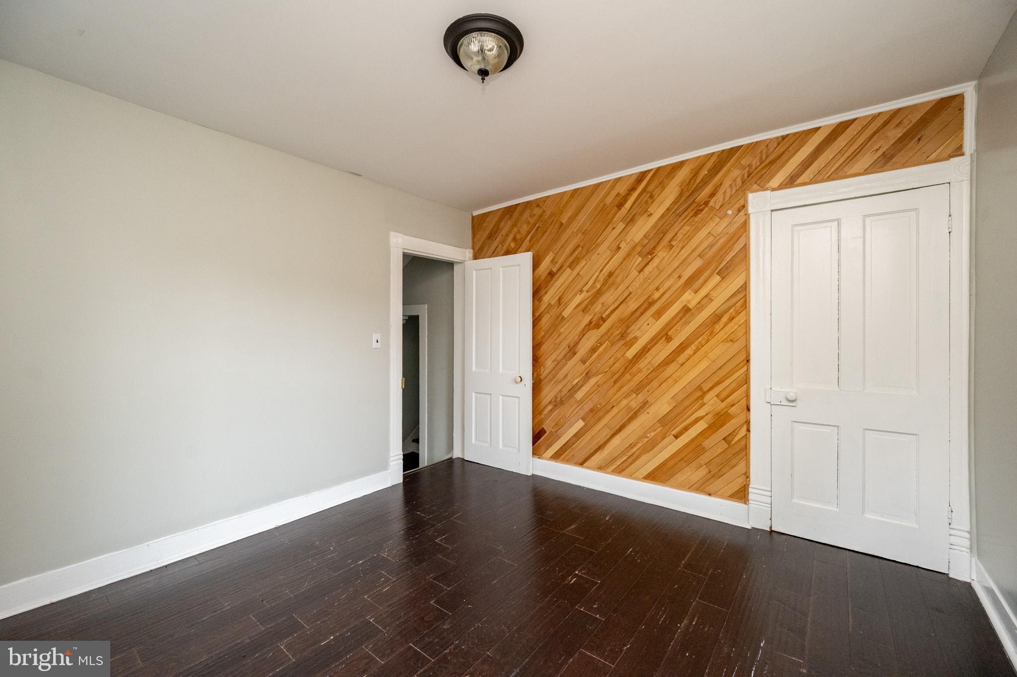 449 South 3rd Street Oakland, MD 21550 - Photo 29 of 64 an empty room with wooden floor and windows