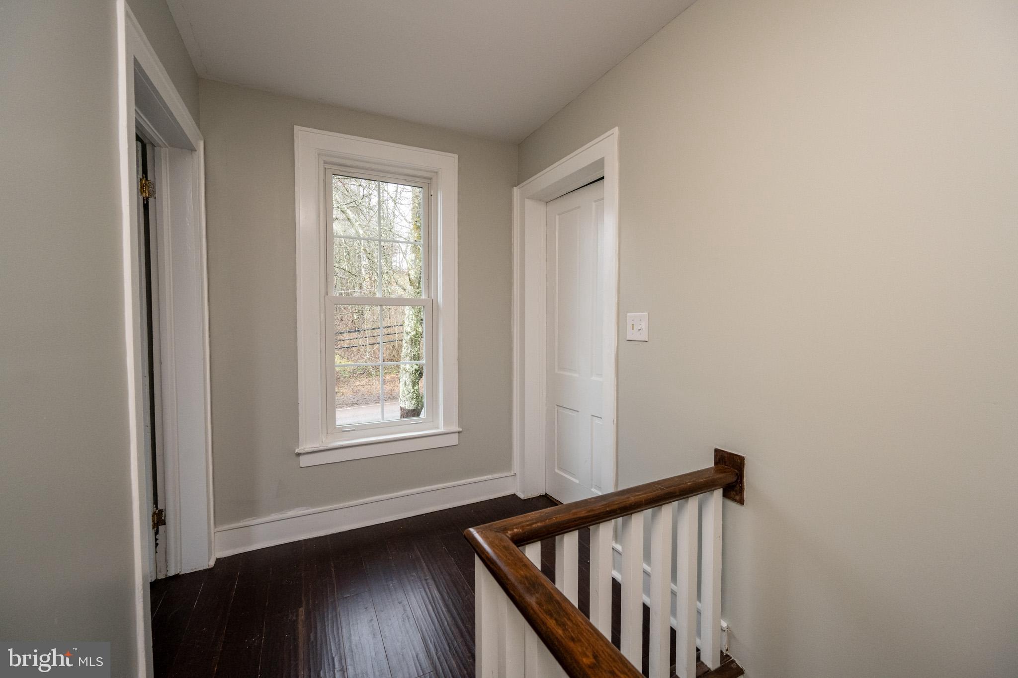 449 South 3rd Street Oakland, MD 21550 - Photo 31 of 64 a view of a hallway with wooden floor and stairs