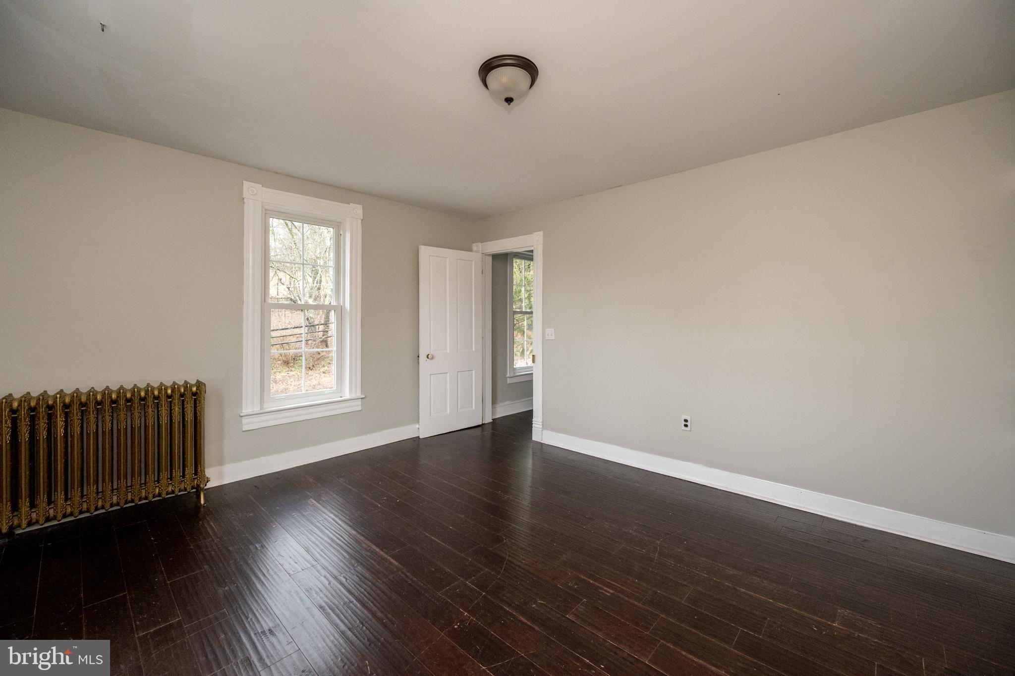 449 South 3rd Street Oakland, MD 21550 - Photo 34 of 64 a view of an empty room with wooden floor and a window