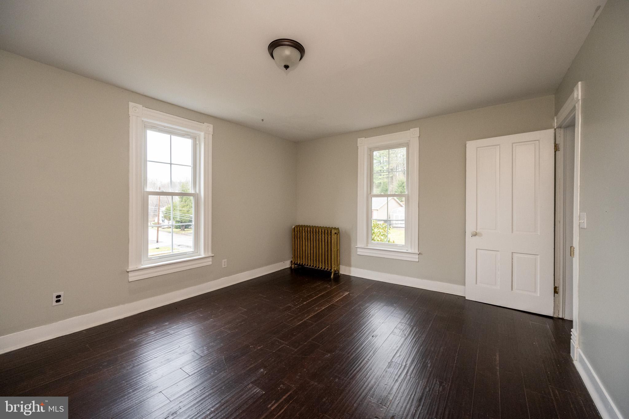 449 South 3rd Street Oakland, MD 21550 - Photo 35 of 64 a view of an empty room with wooden floor and a window