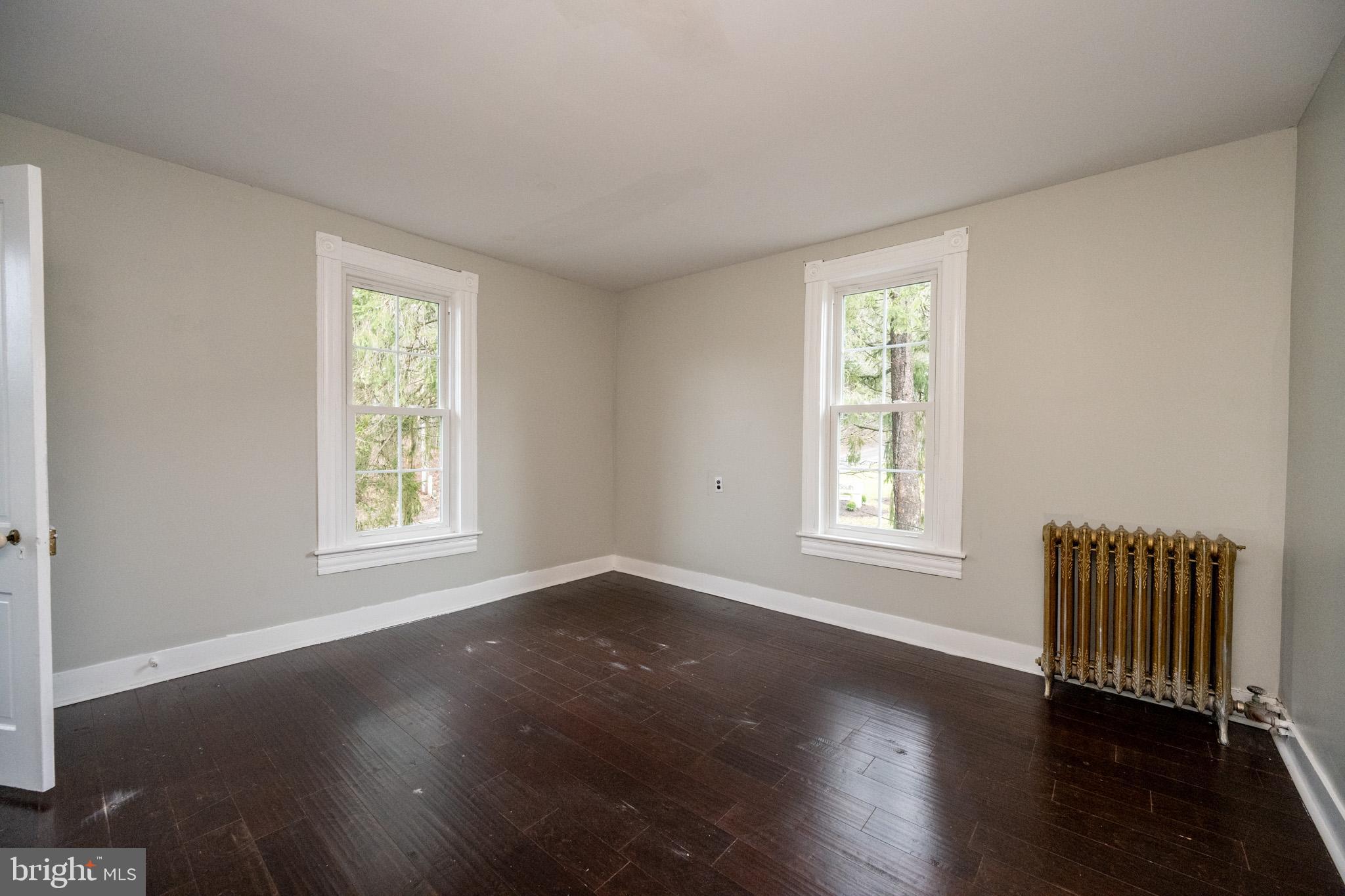 449 South 3rd Street Oakland, MD 21550 - Photo 38 of 64 a view of an empty room with wooden floor and a window