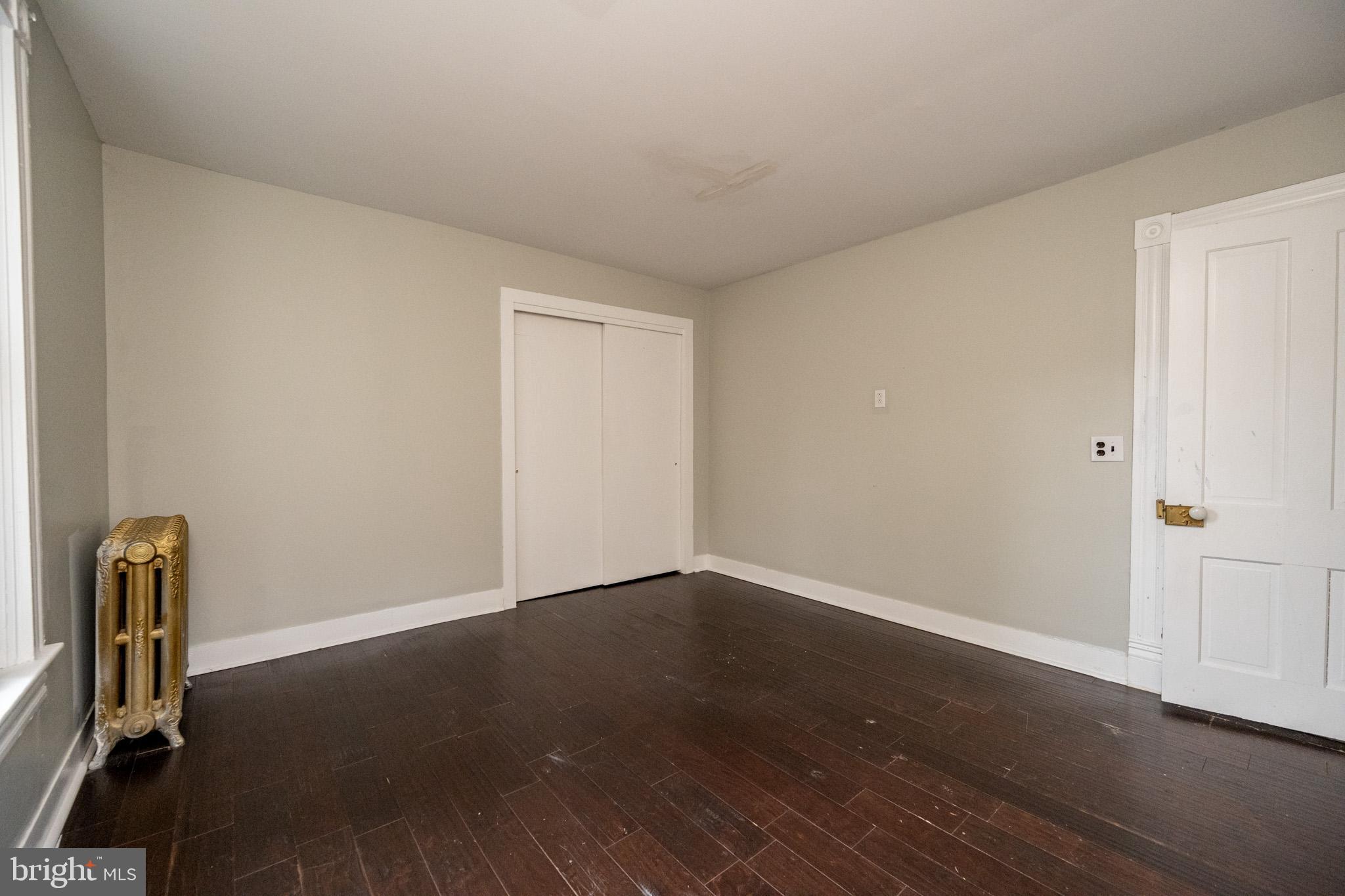 449 South 3rd Street Oakland, MD 21550 - Photo 40 of 64 an empty room with wooden floor and windows