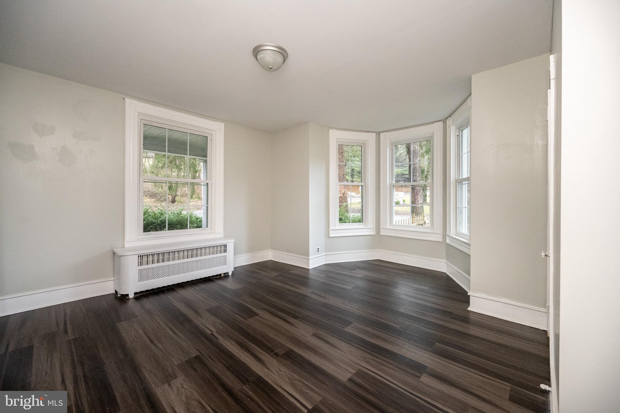 449 South 3rd Street Oakland, MD 21550 - Photo 10 of 64 wooden floor in an empty room with a window