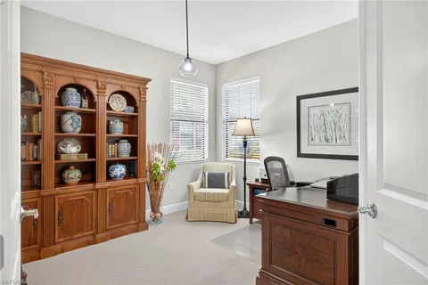 a bedroom with furniture and window