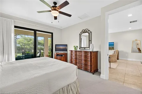 a bedroom with furniture and window