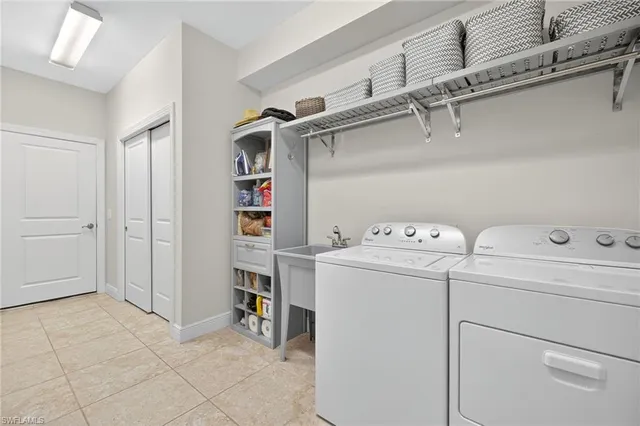 a view of storage and utility room with washer and dryer